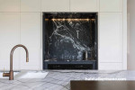 The client's desire for a moody palette was inspired by the selection of marble for the kitchen. 