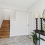 Entryway and stairwell painted in neutral white colours