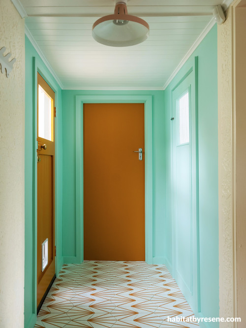Hallway with walls in Resene Vista Blue, doors in Mai Tai