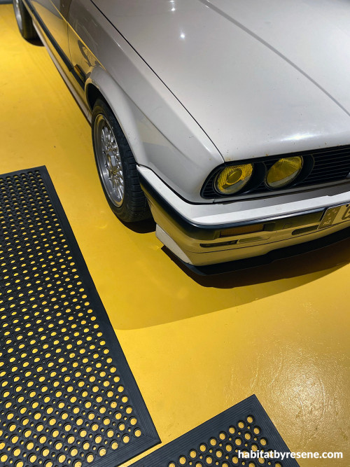 Garage featuring bold yellow floor