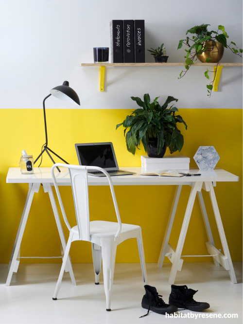 Home office with white upper wall and yellow lower wall