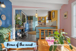 Dining area with soft pink walls and kitchen with bright yellow walls and soft blue cabinets