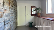 Laundry, laundry featuring a timber wall and a white wall