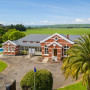 Exterior, house exterior, exterior featuring red brick and grey roof in Resene Grey Friars