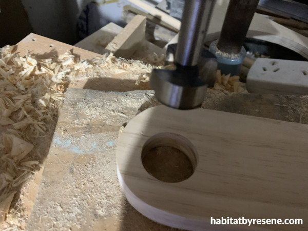 A rounded piece of wood with a round hole in it