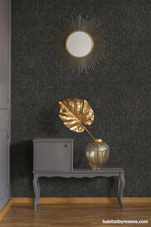 Entranceway featuring deep earthy brown wallpaper