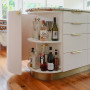 Kitchen island featuring hidden bar