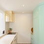 Mint green and white kitchen