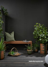 Dramatic dark outdoor patio featuring Resene Karaka