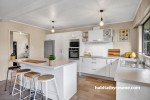 Kitchen painted in Resene Half Tea and ceiling in Resene White