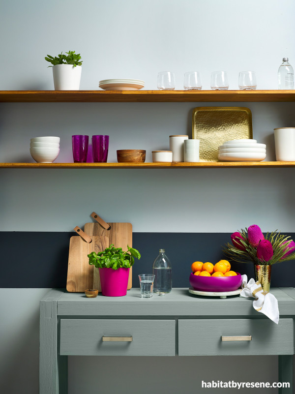 Give a country kitchen a contemporary twist with a chunky kitchen unit painted in Resene Inside Back, set against a Resene Half Duck Egg Blue wall.