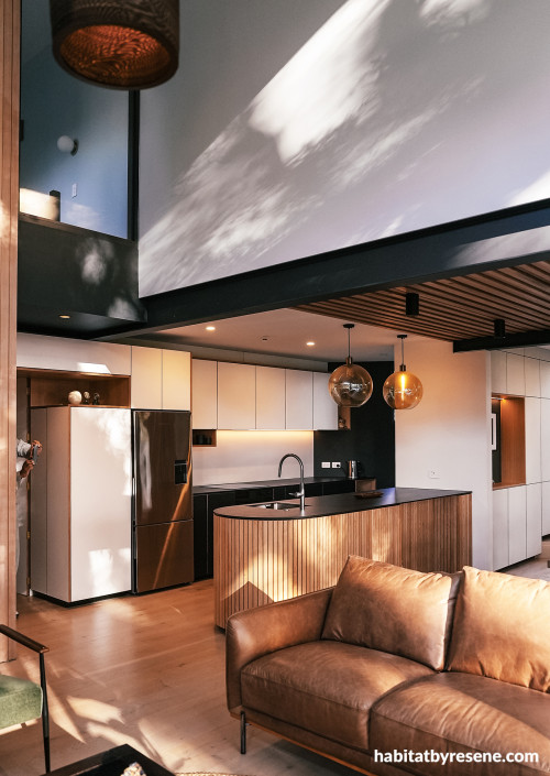 Kitchen with walls in Resene Black White and feature wall in Half Duck Egg Blue