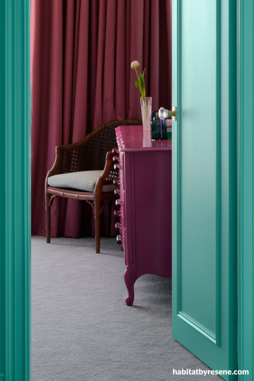 Bedroom furniture featuring Resene Cardinal and doors and trims in Resene Aqua
