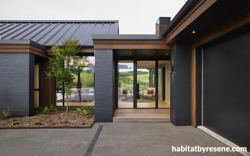 House exterior featuring dark brickwork