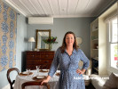 Vanya Wilkinson in her living room painted in Resene Half Periglacial Blue