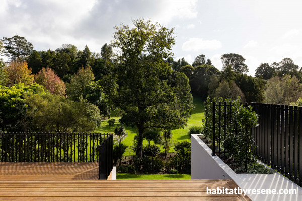 This warm timber deck is finished in Resene Wood-X wood oil tinted to Resene Gold Rush. The planter boxes are Rockcote Torino Sands. 