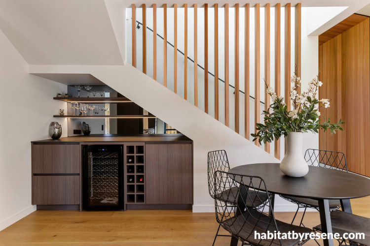 Bar and dining area featuring neutral tones