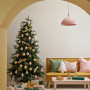 Living room featuring Christmas decor in neutral and mustard theme