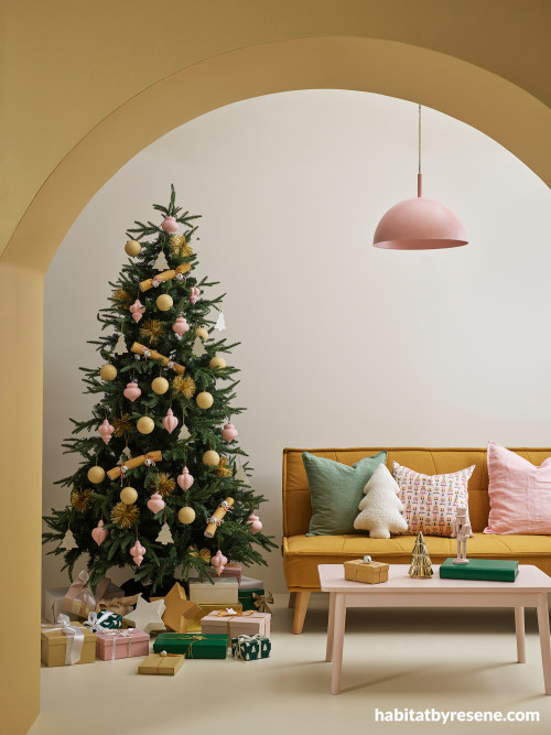 Living room featuring Christmas decor in neutral and mustard theme