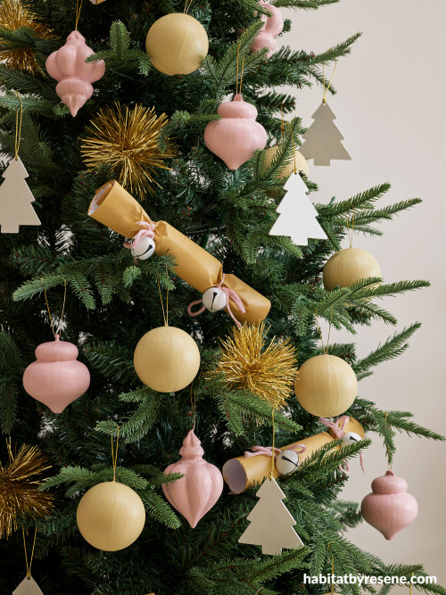 Christmas decorations featuring mustard, white and light pink tones