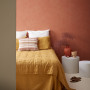 A bedroom painted in Resene orange shades