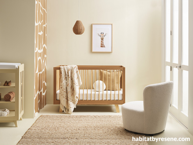 A nursery with giraffe wall pattern