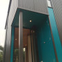 House exterior and back entrance featuring cerulean blue Resene Allports