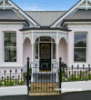 Villa home exterior painted in pale pink Resene Sauvignon