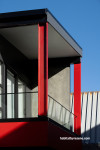 House exterior featuring vivid red Resene Poppy and black wall cladding in Resene Ebony
