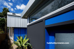 Exterior painted in Resene Wet N Wild and Resene Baltic Sea