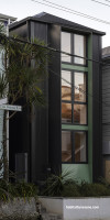 House exterior featuring green Resene Bach paired with Resene Woodsman Pitch Black on the frames and posts
