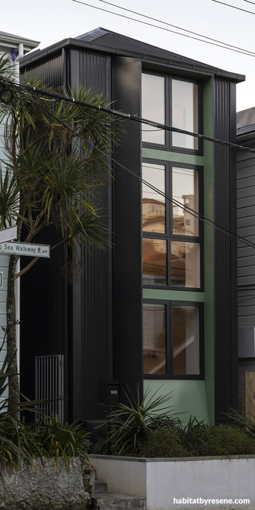 House exterior featuring green Resene Bach paired with Resene Woodsman Pitch Black on the frames and posts