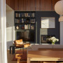 Dining area with fireplace in Resene Porter