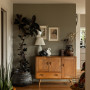 Living area with feature wall painted in Resene Lichen