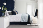 Bedroom, neutral bedroom featuring dark blue feature wall