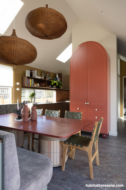 Kitchen and dining area painted in Resene Bullwhip and Resene Quarter Thorndon Cream