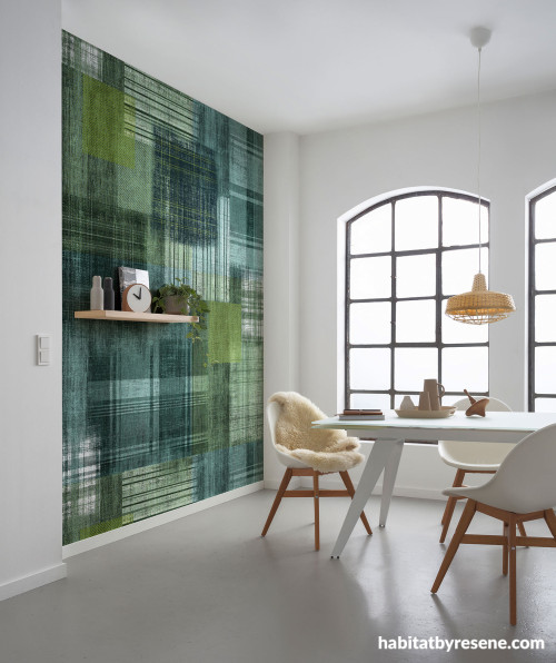 Dining room featuring feature wallpaper in a vibrant green and abstract plaid pattern