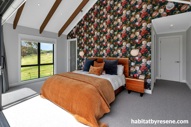 Master bedroom with feature wall featuring bold floral wallpaper