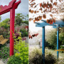Japanese-inspired garden featuring painted arch 
