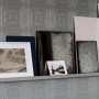 Wall with shelving featuring textured Resene wallpaper