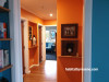 hallway, orange hallway, orange interior, blue and orange interior, resene tango, bright hallway