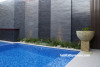 swimming pool, outdoor pool, exterior, water feature, grey wall, grey tiles