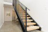 resene alabaster, white walls, scandi design, white entrance, entranceway, hallway, steel staircase