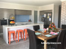 kitchen, dining room, blue splashback, orange chairs, white walls, resene double alabaster