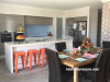 kitchen, dining room, blue splashback, orange chairs, white walls, resene double alabaster