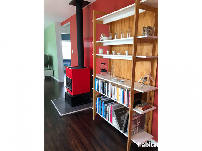 red dining room, red fireplace, fire place inspiration, open plan living, bookshelf, Resene