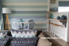 holiday house, feature wall, blue, living room, bach, beach house, stripe, stripes, paint ideas