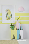 parrot artwork, yellow striped wall, striped feature wall, yellow lounge, parrot print